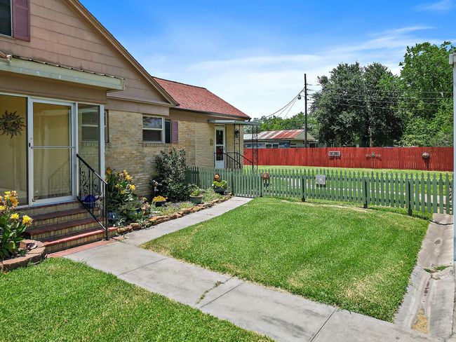 The side entrance to the home takes you directly to the den. | Image 5
