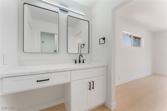 Bathroom featuring vanity and wood finished floors | Image 31
