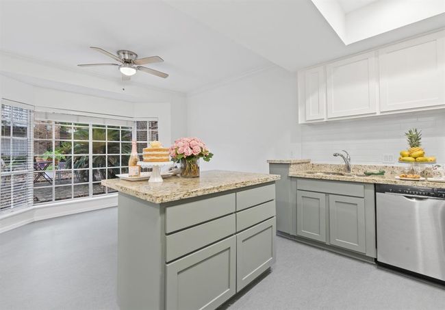 Another view of kitchen. Stainless steel Bosch dishwasher. | Image 6