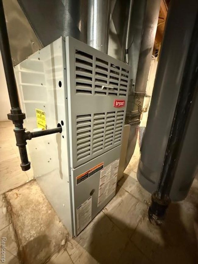 Utility room featuring heating unit | Image 30