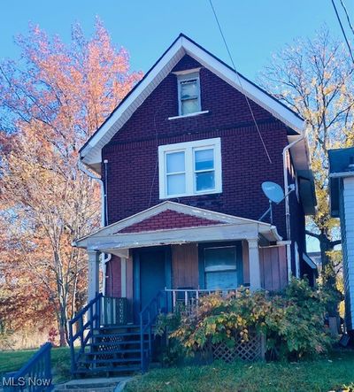 View of front of home with covered porch | Image 1