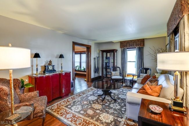 Living area with wood finished floors | Image 7