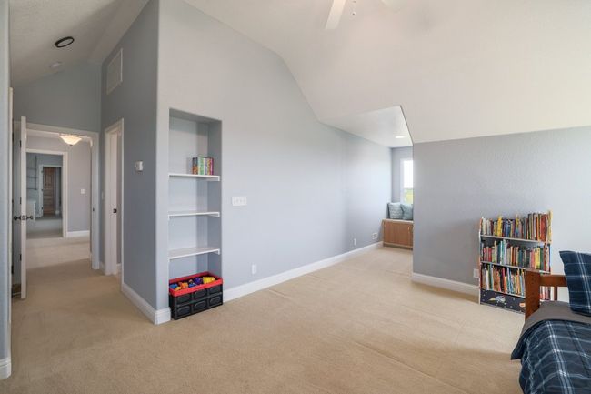 Bedroom #4 with built in bookshelf. | Image 28