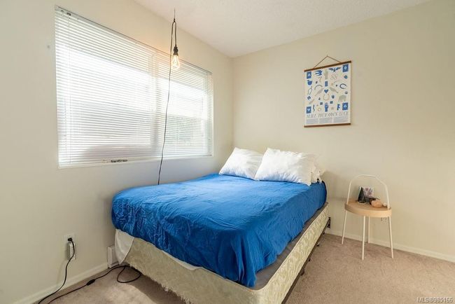 Bedroom with light colored carpet | Image 13