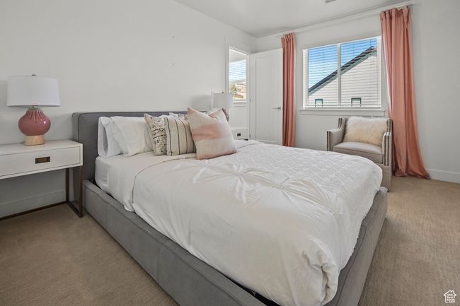 Bedroom featuring light carpet and baseboards | Image 23