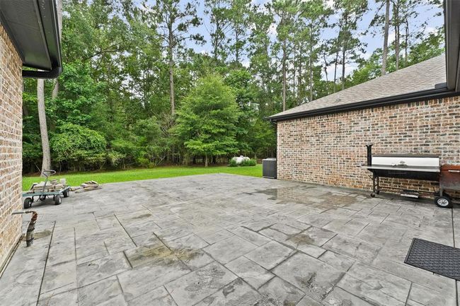 Side patio consisting of Approx 1000 sq ft of stamped concrete | Image 29