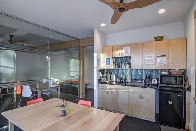 Main floor break room has patio doors to outer patio area. | Image 11