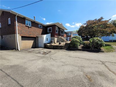 Large driveway not only provides lots of off street parking but leads to the integral garage! | Image 2