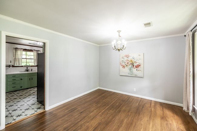 Located just off the kitchen this a perfect place for a dining room. | Image 21