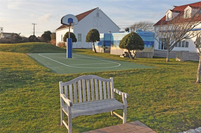 View of sport court featuring a yard and community basketball court | Image 21