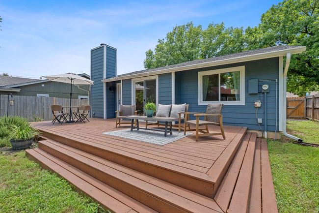 Wooden deck with an outdoor living space | Image 33