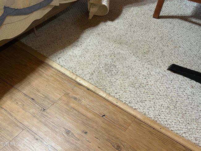 hardwood floor/ carpet in bedroom | Image 58