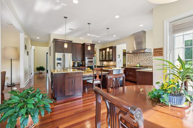 Full View of Eat in Kitchen into Dinette Area, Braziian Flooring | Image 10