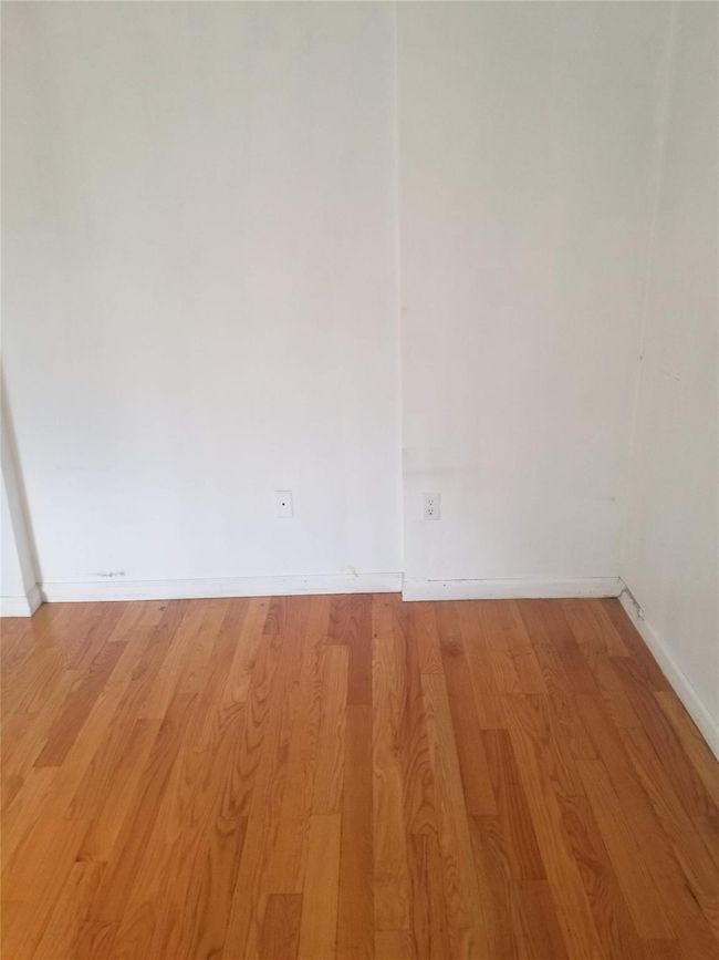 Empty room featuring light wood finished floors and baseboards | Image 5