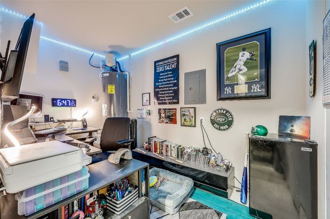 Office space featuring electric panel and water heater | Image 32
