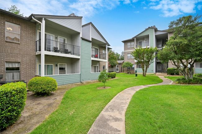 Surrounding community featuring a lawn | Image 17