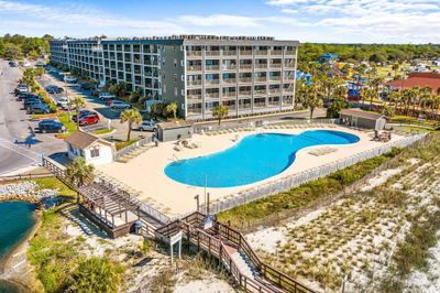 View of swimming pool with a water view and a patio | Image 1