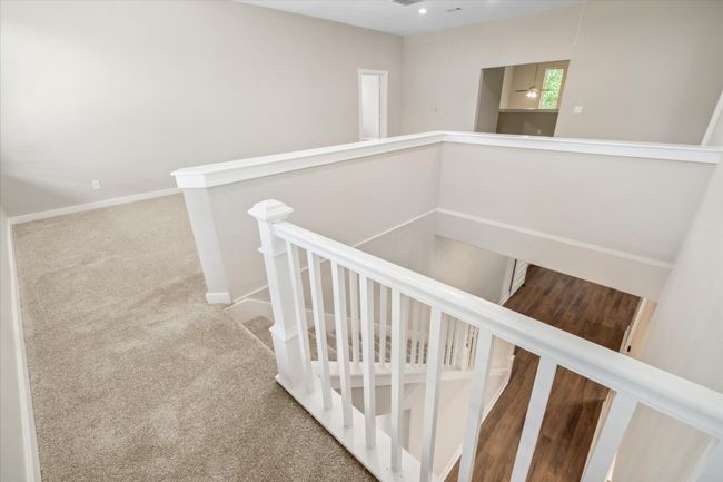 Staircase featuring carpet flooring and baseboards | Image 22