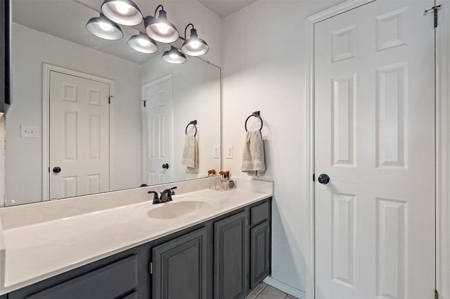 Bathroom with tile patterned flooring and vanity | Image 30