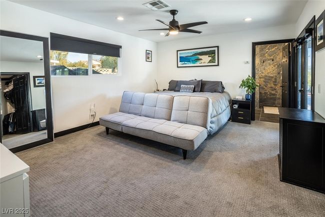 Bedroom featuring recessed lighting, visible vents, and light colored carpet | Image 18