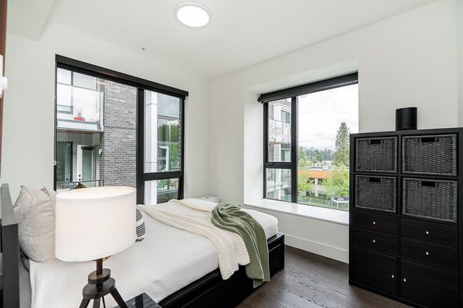 Bedroom with dark wood-style floors and baseboards | Image 24