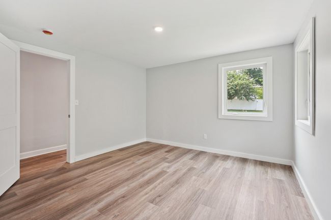 1st fl room featuring light wood-style floors and baseboards | Image 14
