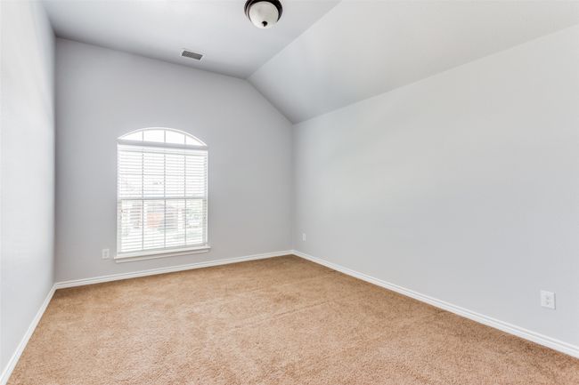 Unfurnished room with carpet and vaulted ceiling | Image 27