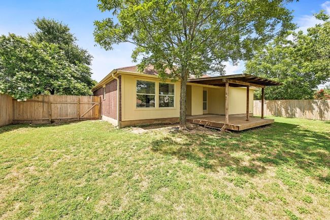Back of property featuring a fenced backyard and a deck | Image 29
