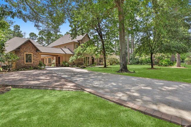 There is lots of parking available at the home. There is an extended drive with small parking lot, & a porte cochere leading to a 3-car garage... | Image 7
