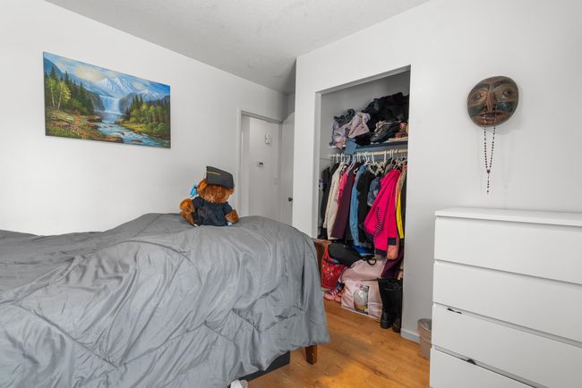 Bedroom featuring light wood-style floors and a closet | Image 19