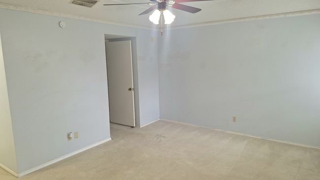 Primsry Bedroom featuring light colored carpet, a ceiling fan, crown molding, and a smoke detector | Image 18