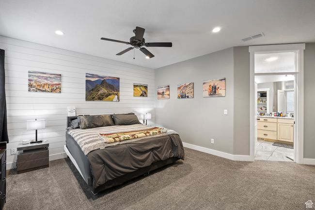 Bedroom with light carpet, baseboards, recessed lighting, ensuite bath, and a ceiling fan | Image 30