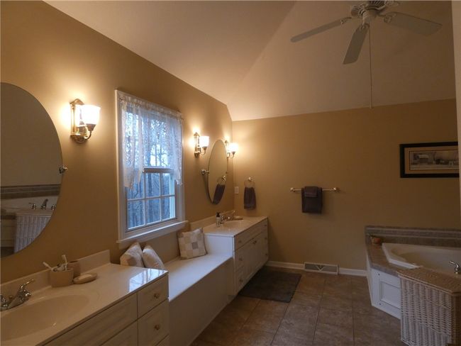 Welcome to your large ensuite featuring double vanities and a built in window seat | Image 30