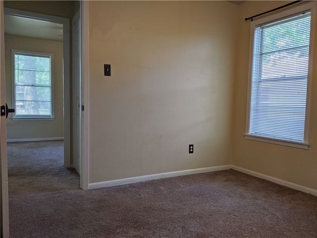 Carpeted spare room featuring baseboards | Image 7