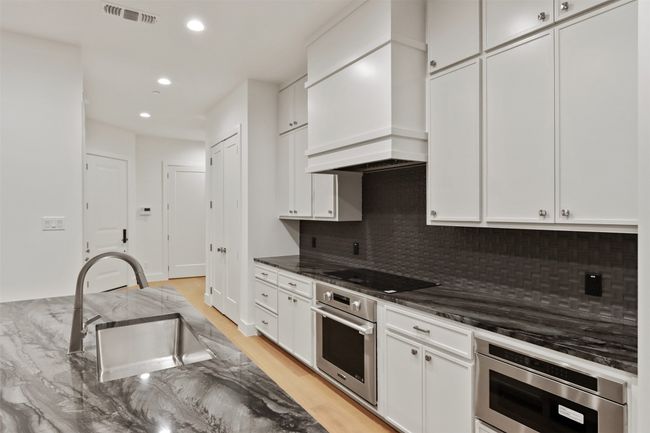 Kitchen with skinny shaker custom cabinets | Image 13