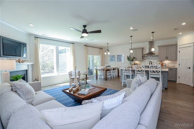 Bright and spacious family room with gas fireplace. | Image 9