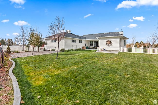Back of house with a patio area and a yard | Image 9