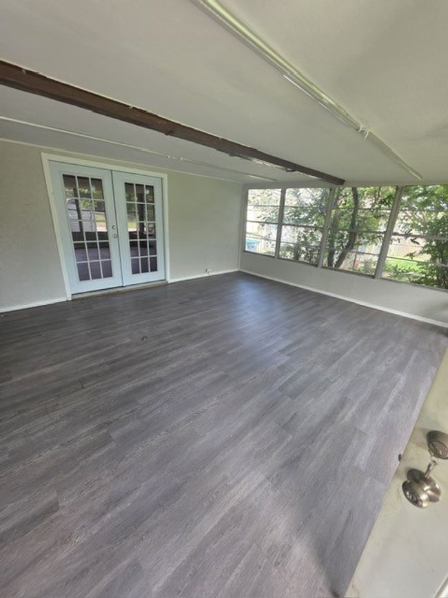 Unfurnished sunroom with french doors | Image 9