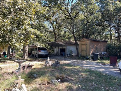 View of front facade with a storage unit and a carport | Image 2