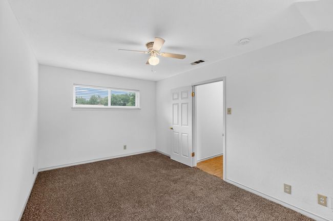 Unfurnished bedroom featuring carpet floors and ceiling fan | Image 23