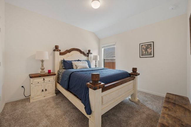 Carpeted bedroom featuring vaulted ceiling and baseboards | Image 21