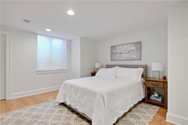 Bedroom with recessed lighting, baseboards, visible vents, and light wood-type flooring | Image 55