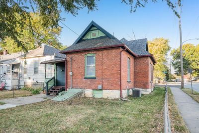 View of rear of house, covered deck and patio. | Image 3