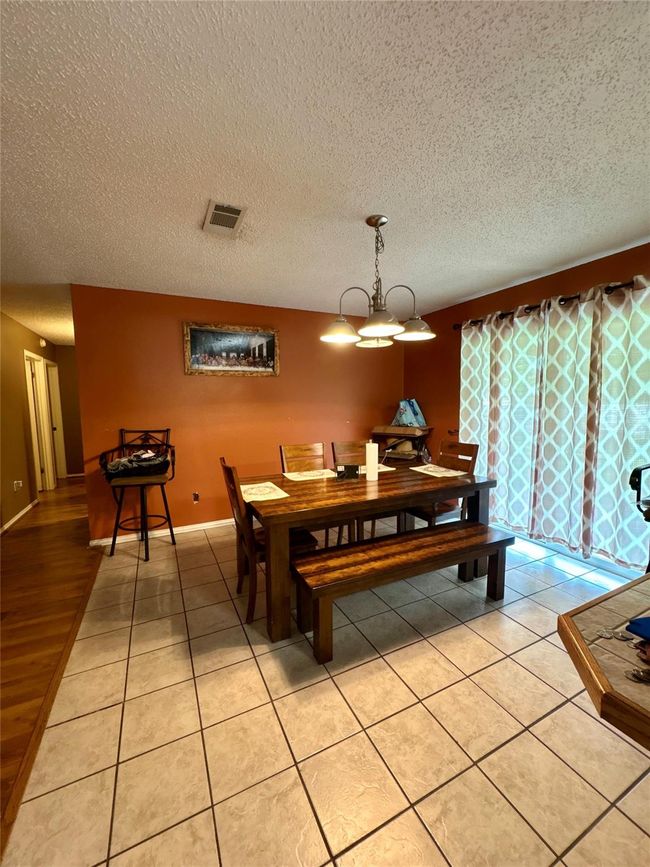 Dining Area with natural light enhancing the mood for family nights | Image 18