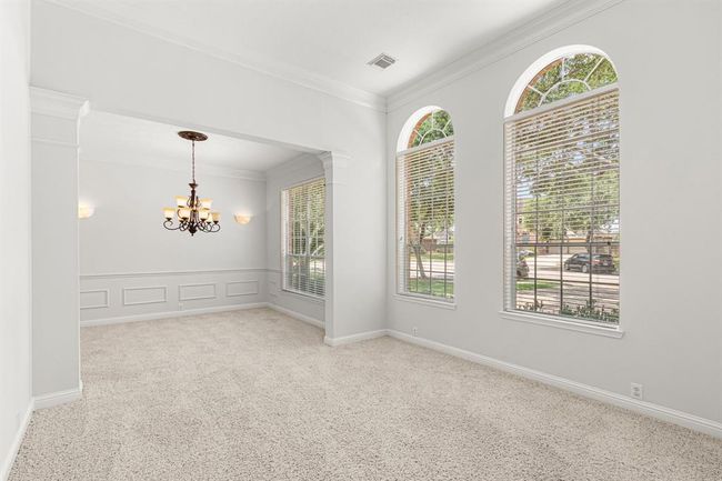 The formal living and dining rooms are light and bright! | Image 5