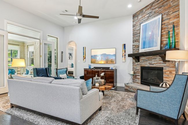 Living room with floor to ceiling fireplace | Image 7