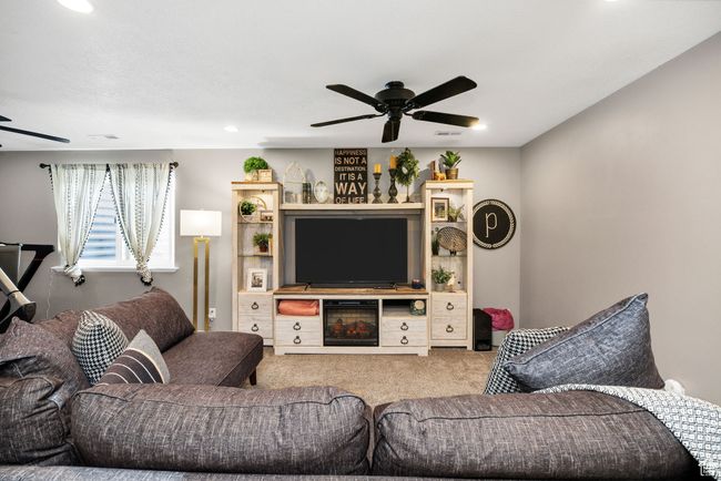 Living room featuring recessed lighting, carpet flooring, a ceiling fan, and visible vents | Image 24