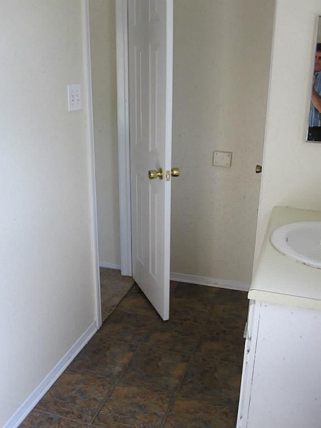master bathroom sink and towel closet. has a shower only in the master bedroom. | Image 9