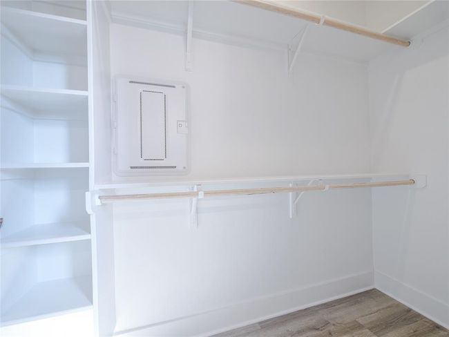 Walk in closet featuring wood finished floors | Image 19