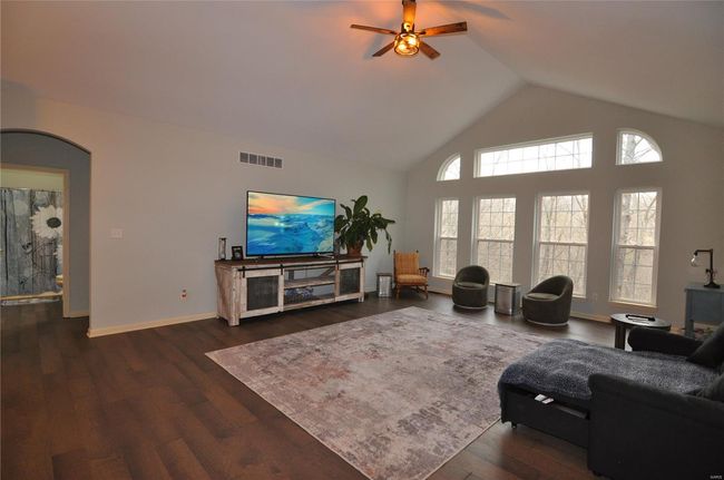 Inviting Great room with wall of windows, beautiful in all seasons. | Image 6